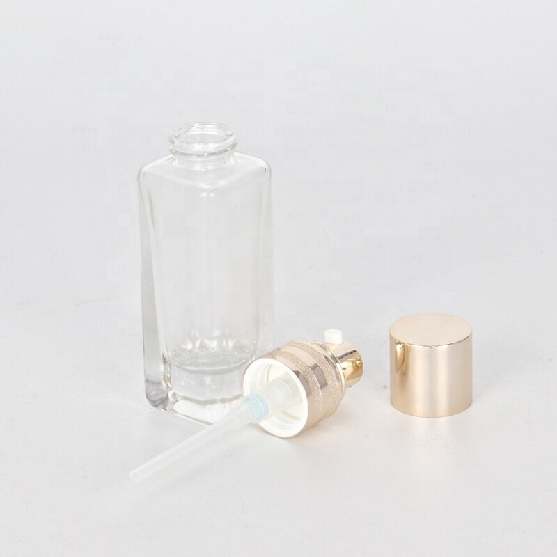 Slim and tall glass bottle for lotion and serum clear glass bottle with pump