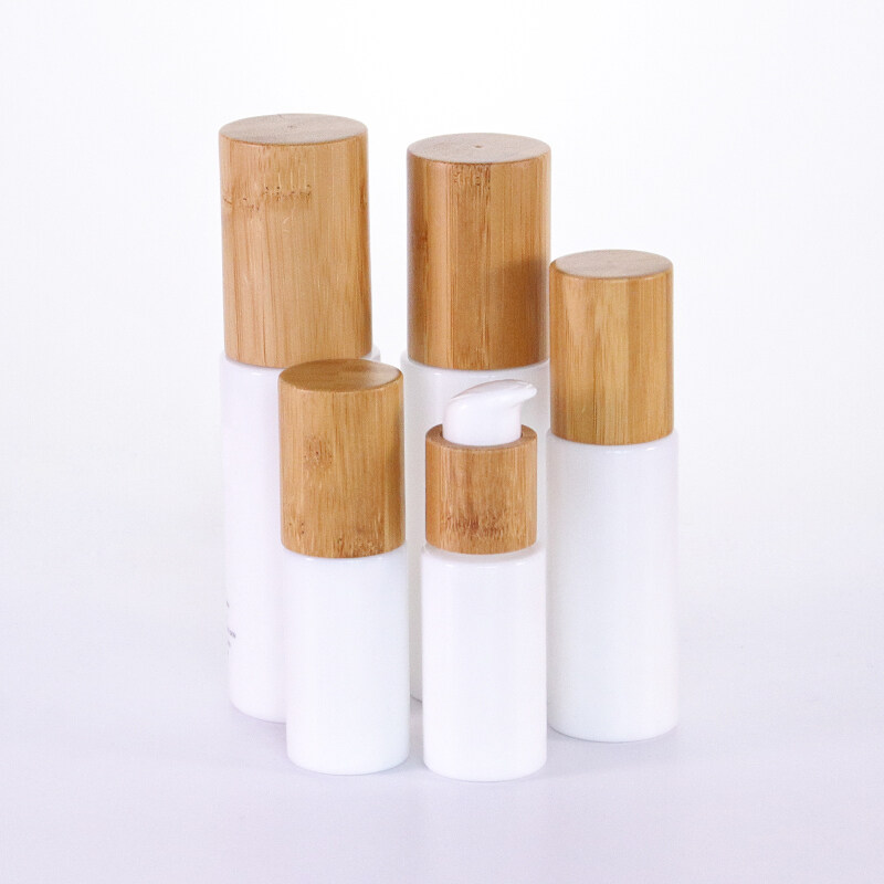 China Supplier and Home White Cosmetic Container Glass skincare Lotion Bottle with bamboo lid