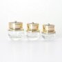 Luxury golden lid glass jars for skin care storage thick bottom stylish design clear jars customization