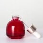 Red glass serum bottle with green dropper bulb shape small size essential oil bottle customization