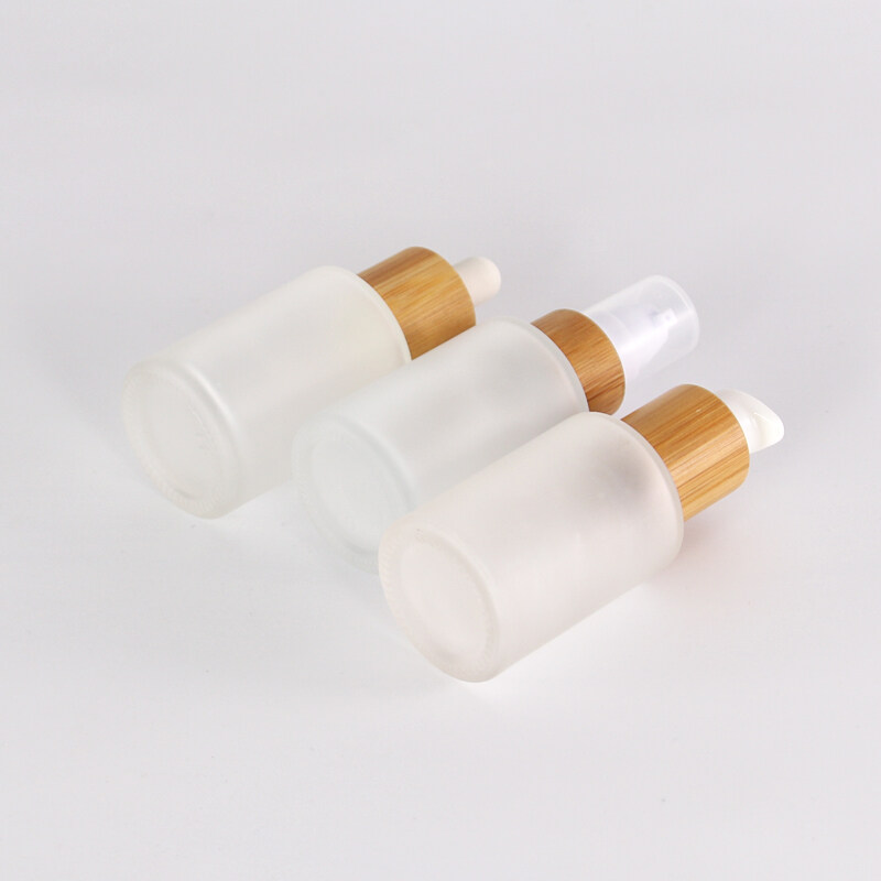 Wholesales 20ml 30ml 50ml 60ml 80ml white oil frosted round glass e liquid pump bottle with bamboo wooden cap