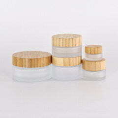 Hot Sale 50ml 60ml 100ml Cleat Frost Glass Jar with CRC Bamboo Cap for Face Cream