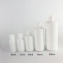 Glossy and matte opal white glass bottle for skin care package round shoulder glass products with plastic lids