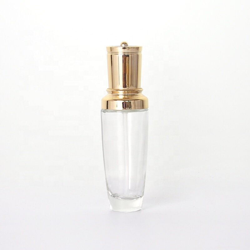 100ml clear bottle with golden serum pump clear glass bottle for serum and lotion storage