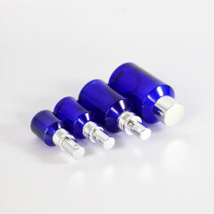 Wholesale blue glass essential oil bottles glass cream jars multi-size empty high quality cosmetic packaging