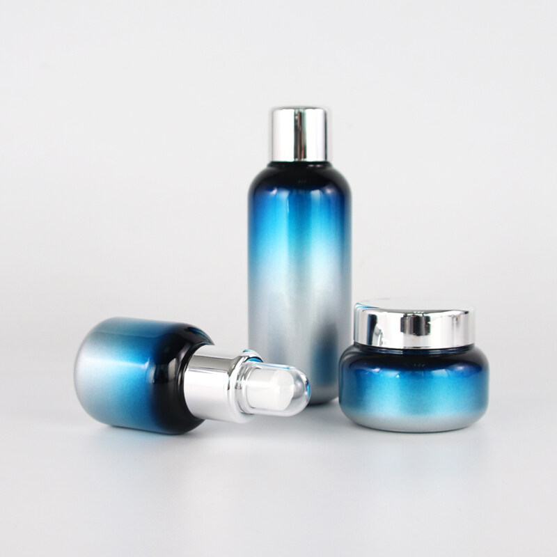 wholesale customized glass bottle set with sliver color plastic pump  cosmetic cream glass