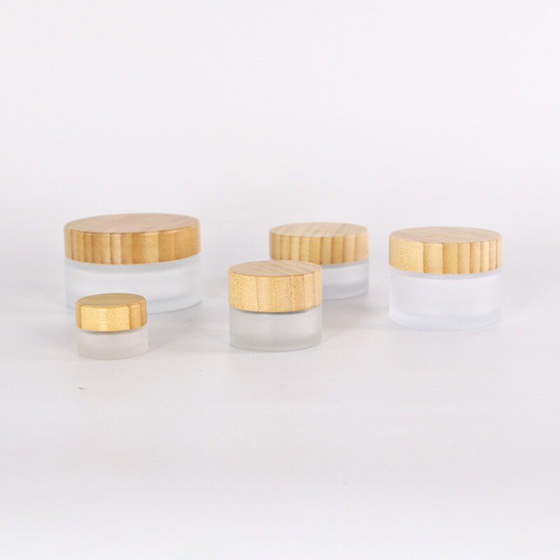 Factory Supply 5g 10g 15g 30g 50g 100g glass frosted food candy packaging clear glass cosmetic cream jar with bamboo lid