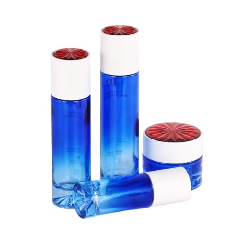 wholesale the gradient blue glass bottles and cream jar, white plastic cover with red snowflake pattern