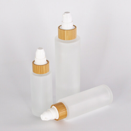 high quality customized glass lotion bottle with sprayer pump bamboo collar glass bottle