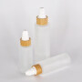high quality customized glass lotion bottle with sprayer pump bamboo collar glass bottle