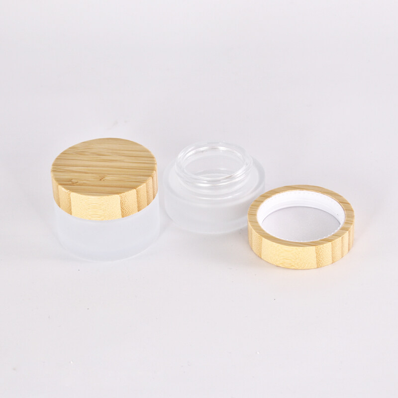 Hot Sale 50ml 60ml 100ml Cleat Frost Glass Jar with CRC Bamboo Cap for Face Cream