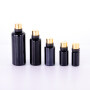 Hot selling round black  cosmetic essential oil glass dropper bottles