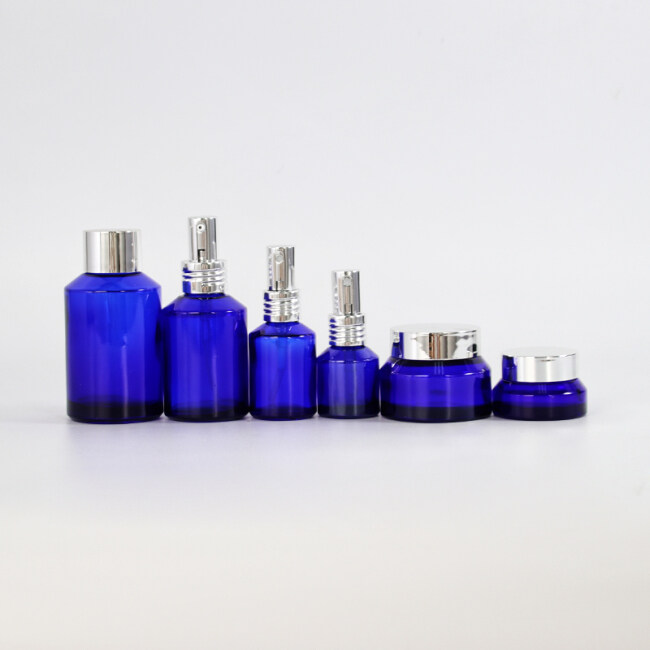 Manufacturer cobalt blue sloping shoulder glass bottle and cream glass jar blue glass bottle and jar