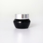 Black oblique shoulder cream jar with silver spray lid