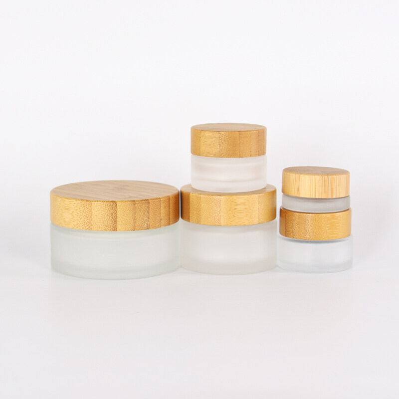 Hot selling 5g 30ml 50g 100ml clear frosted glass jar cosmetic skincare scrub cream customized logo jar with bamboo lid