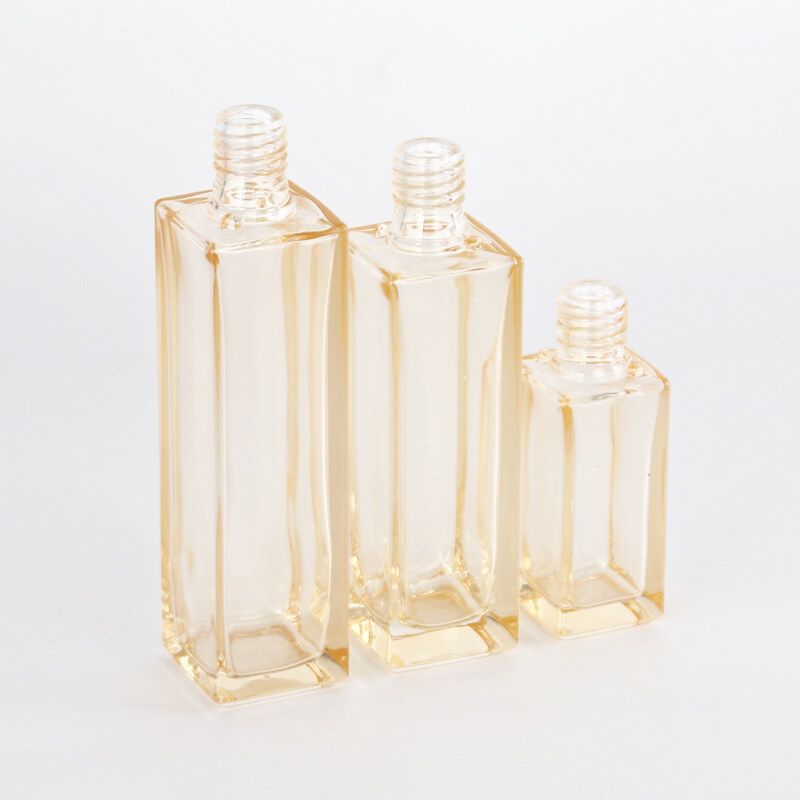wholesale the golden glass bottles and cream jar clear high quality plastic cover with stripe