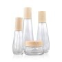 Wholesale  luxury clear glass bottle with water transfer cap bottle, high quality cosmetic clear glass bottle