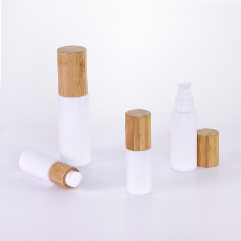 China Supplier and Home White Cosmetic Container Glass skincare Lotion Bottle with bamboo lid