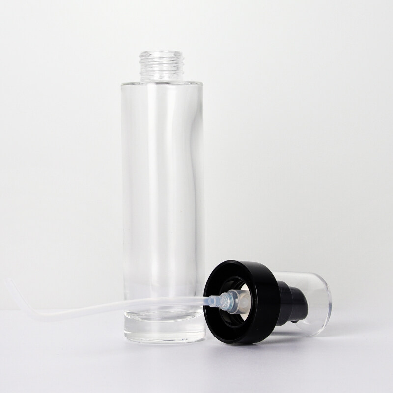 Cylindrical transparent glass bottle press spray pump black painting  color cap toner bottle empty bottle