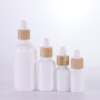 Cosmetic packaging 10ml 15ml 30ml 50ml 100ml white essential oil glass dropper bottle,bamboo dropper for white glass bottle