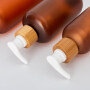 60 ml Amber color Plastic Boston Round PET Bottle with bamboo pump cosmetic packaging plastic bottle