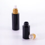 New design opaque black cosmetic glass wood grain pump bottle with wood grain pump and sprayer