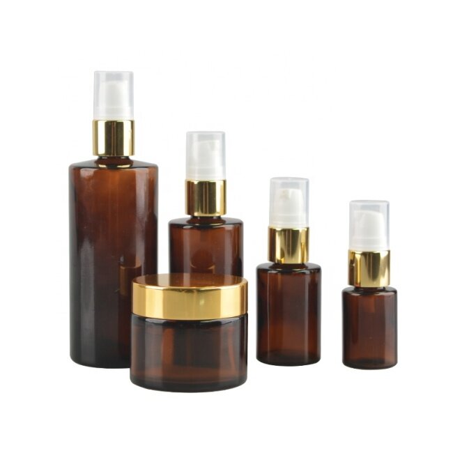 Amber glass cosmetic bottles and jars cosmetic packaging set wholesale with golden caps, 50ml 200g 200ml amber cream glass jar