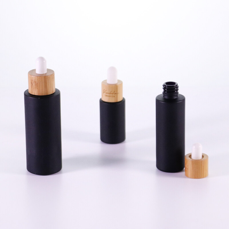 Natural 20ml 30ml 40ml 60ml  frosted black round flat shoulder glass essential oil dropper bottle with bamboo lid