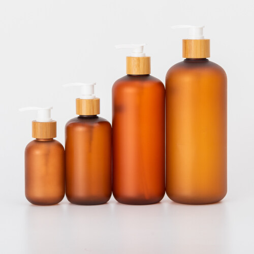 Amber matte 150ml 250ml 500ml scrub body wash lotion cream hair oil set PET plastic water spray pump bottle with bamboo cover