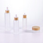 Bamboo skincare packaging set bamboo pump bottle frosted glass jar with bamboo lid