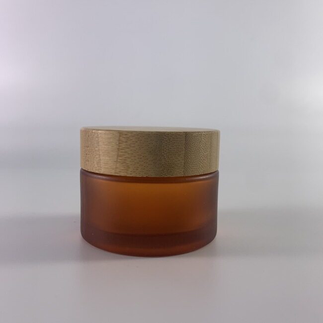 Hot sale and durable frosting amber cosmetic glass storage jar,bamboo lid for amber glass jar