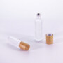 factory sale essential oil perfume 10ml clear transparent round shape roll on glass roller bottle with bamboo lid Payment Terms