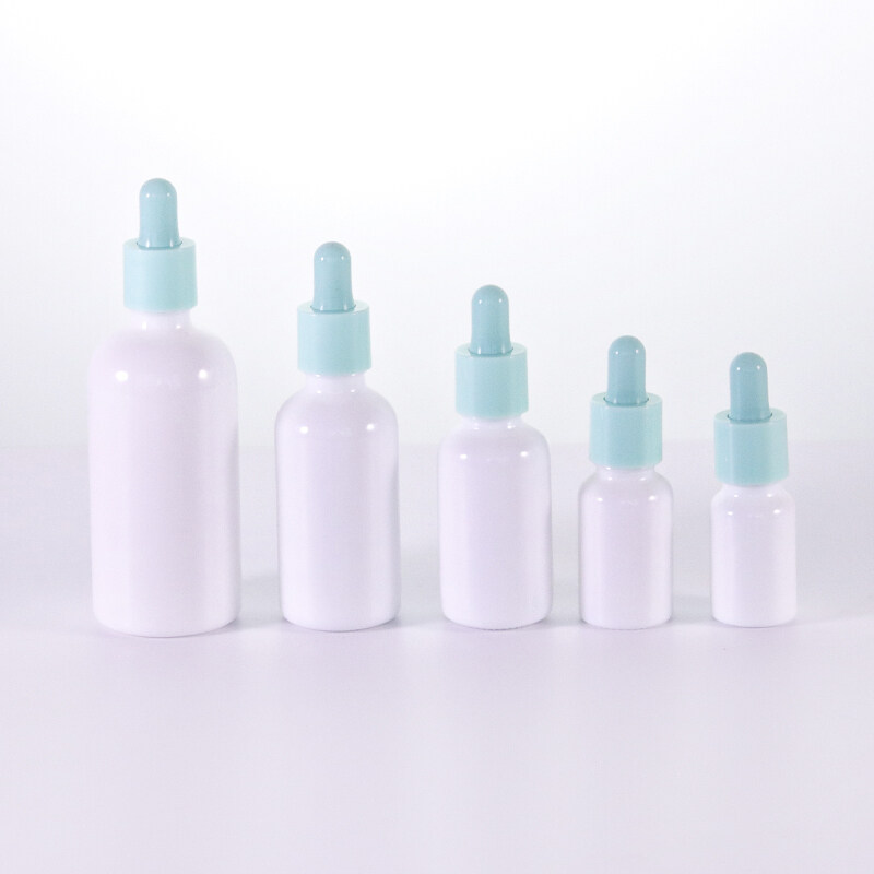 Hot Selling Glass Eye Dropper Bottles White Porcelain Glass Bottles With Blue Lids For Essential Oil Serum Aromatherapy