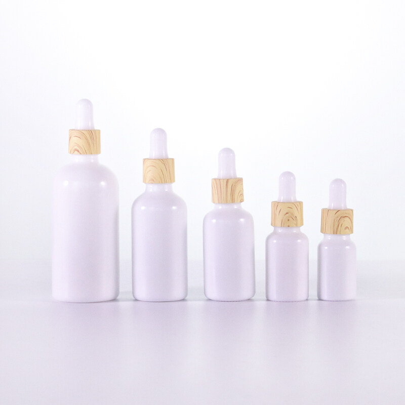 Hot Selling luxury empty opal white  glass cosmetic bottles with water transfer plastic lids for skin care essential oil