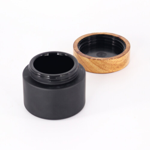 Eco-friendly material cosmetic packaging jar Luxury matte black glass cosmetic package jar with wood lids