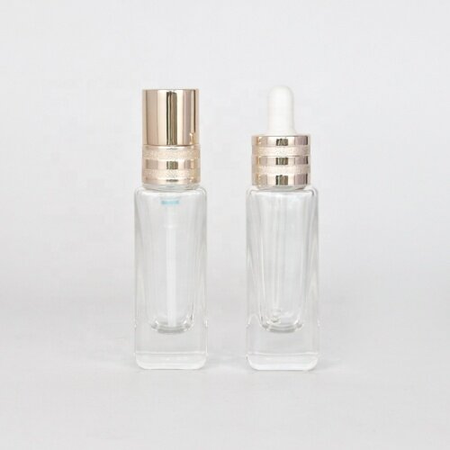 Slim and tall glass bottle for lotion and serum clear glass bottle with pump