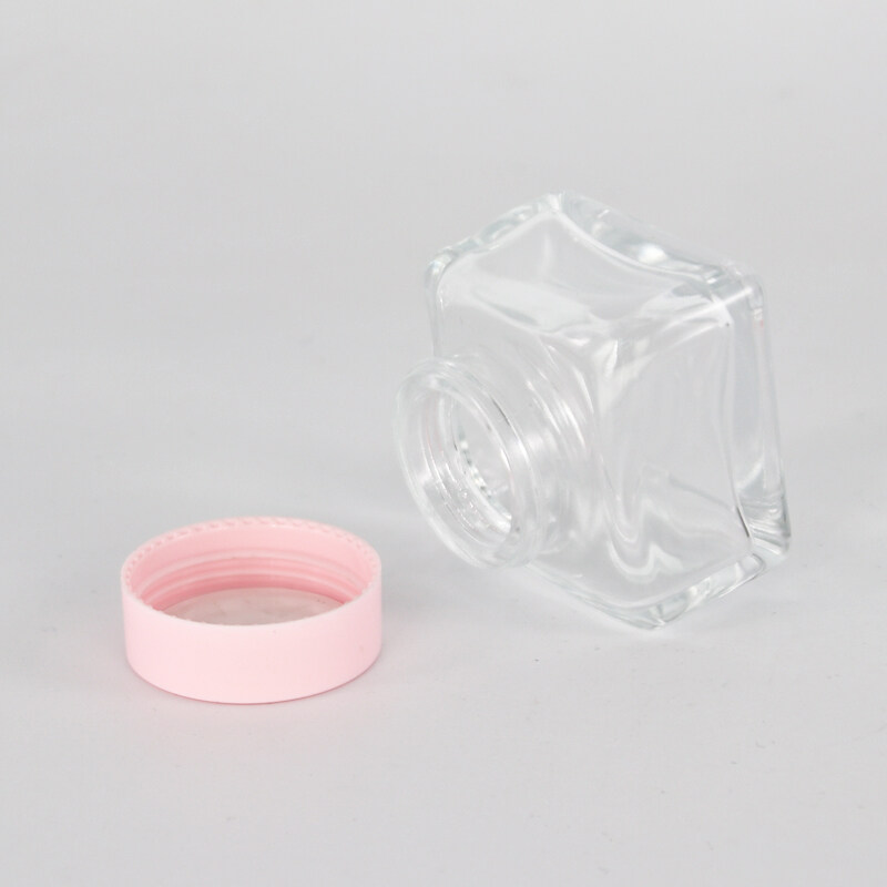 wholesale high quality clear glass bottle and glass jar with pink plastic cover
