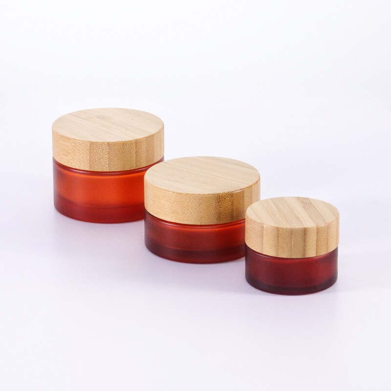 Hot sale and durable frosting amber cosmetic 5g 15g 30g 50g 100g glass jar,bamboo lid for amber glass jar