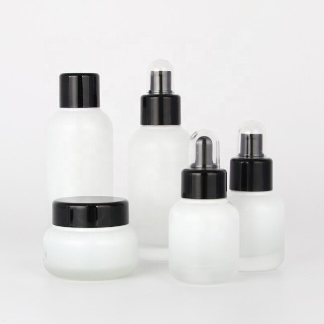 New developed ivory-white glass bottles and jars with black plastic cap