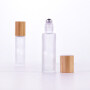 factory sale essential oil perfume 10ml clear transparent round shape roll on glass roller bottle with bamboo lid Payment Terms