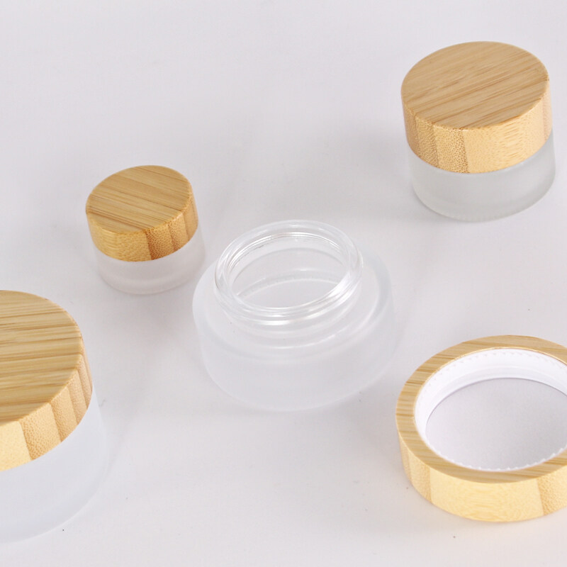 Hot sale cosmetic face cream container bamboo lid 5ml 15ml 30ml 50ml 100ml frosted clear glass jar