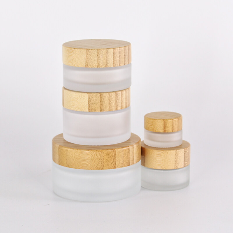 Hot sale cosmetic face cream container bamboo lid 5ml 15ml 30ml 50ml 100ml frosted clear glass jar