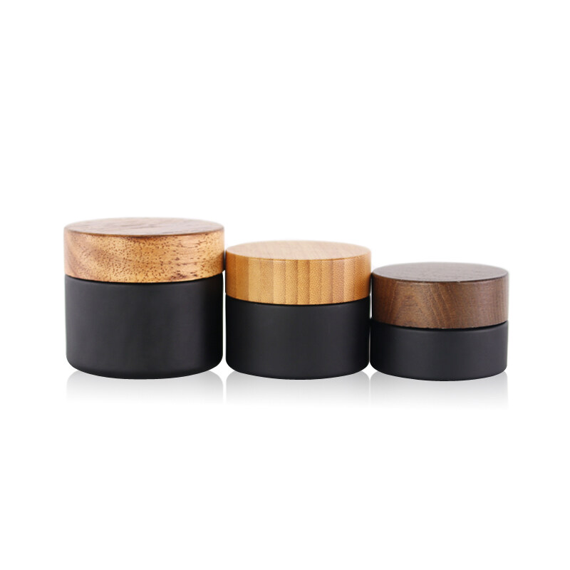 30g 50g 100g frosted black cosmetic glass jar with wooden lid