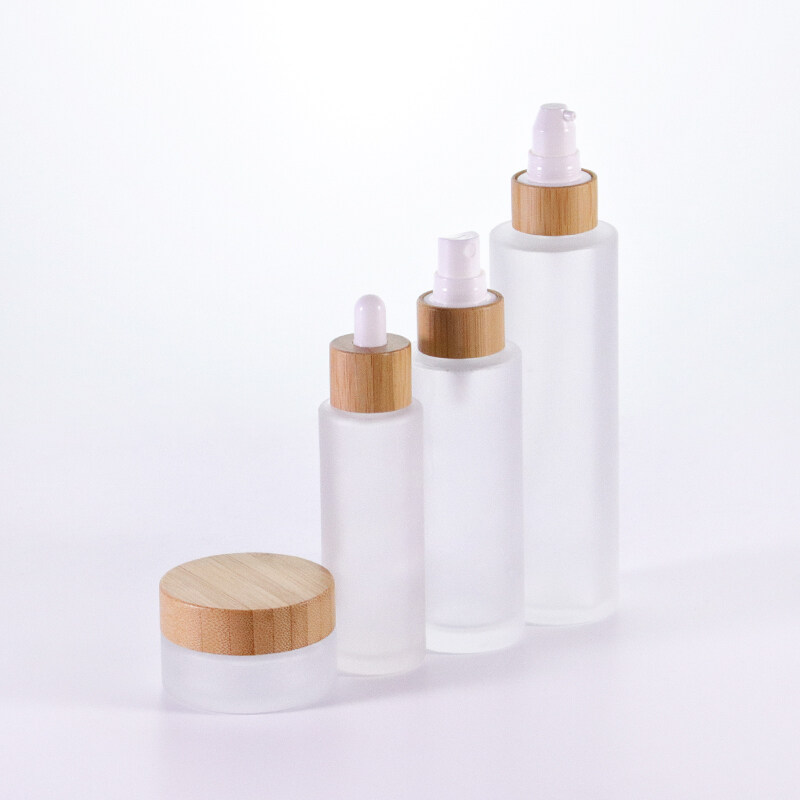 Bamboo skincare packaging set bamboo pump bottle frosted glass jar with bamboo lid