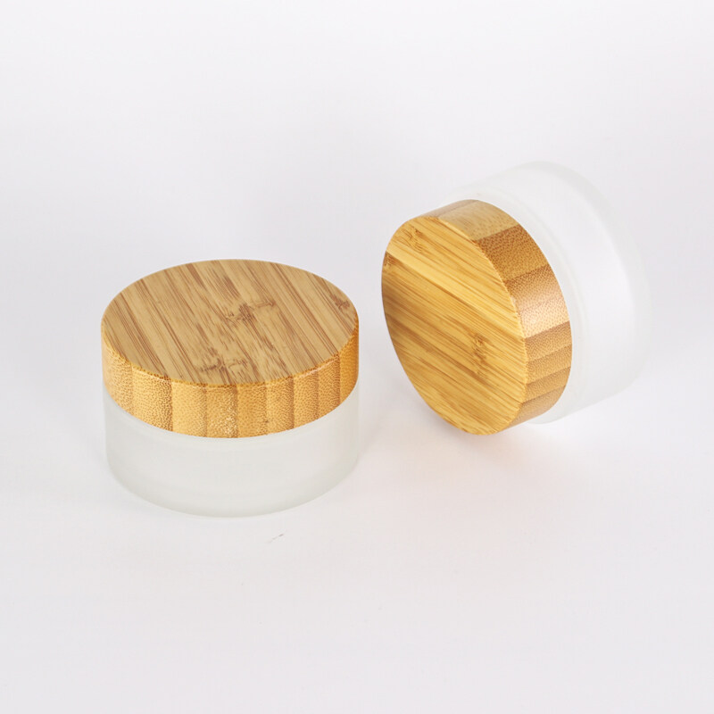 Hot selling 5g 30ml 50g 100ml clear frosted glass jar cosmetic skincare scrub cream customized logo jar with bamboo lid