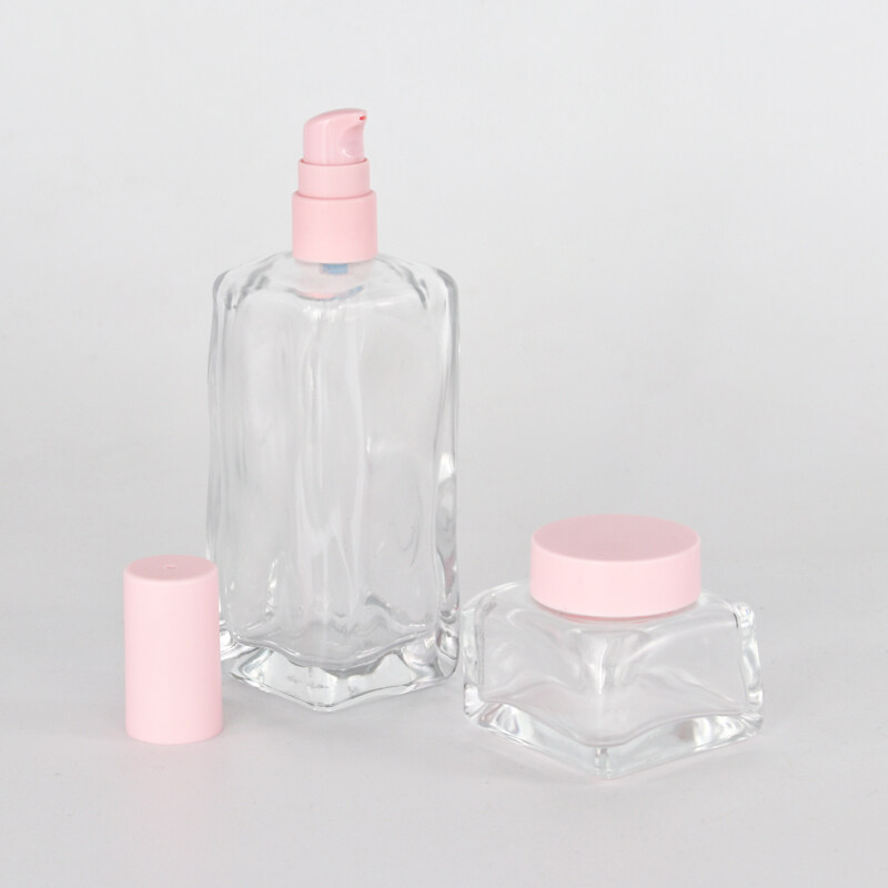 wholesale high quality clear glass bottle and glass jar with pink plastic cover