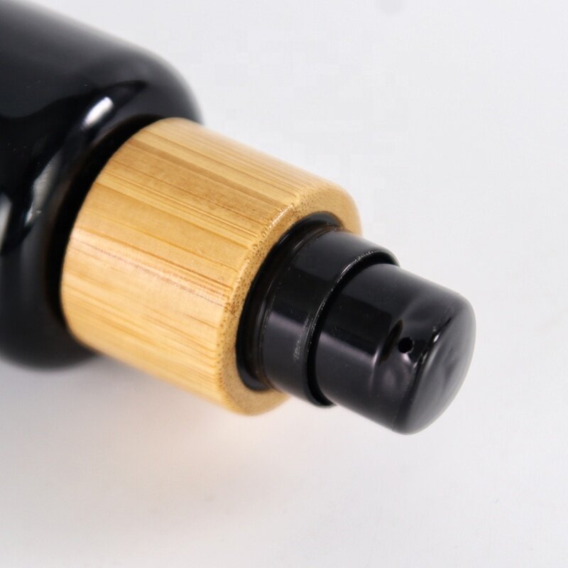 Round shoulder black glass bottle for skin care package bamboo collar opaque black glass products with plastic lids
