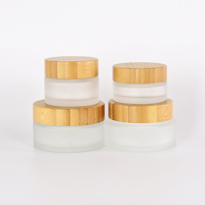 High Quality 30g 50g 100g Refillable  Skin Care Container Cosmetic Bamboo Packaging Frosted Glass Jar with Bamboo Lid