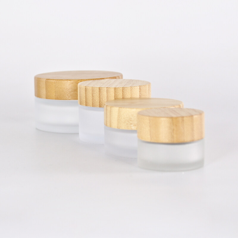 Hot sale cosmetic face cream container 5ml 15ml 30ml 50ml 100ml frosted clear glass jar with bamboo wood lid