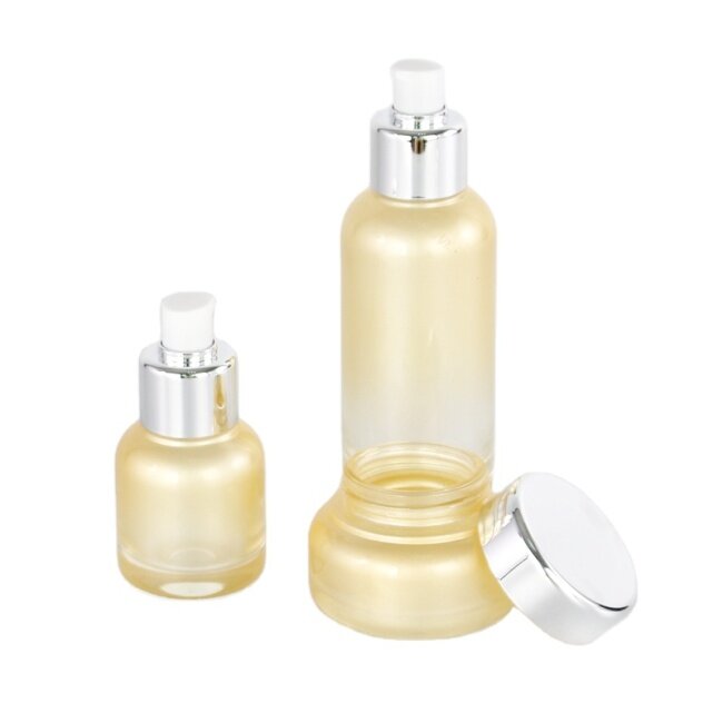 wholesale customized glass bottle set with white color plastic dispenser pump with aluminum collar